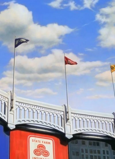 Baseball-inspired artwork showing stadium grandstands, colorful team flags, and vintage signs beneath a blue sky with white clouds.